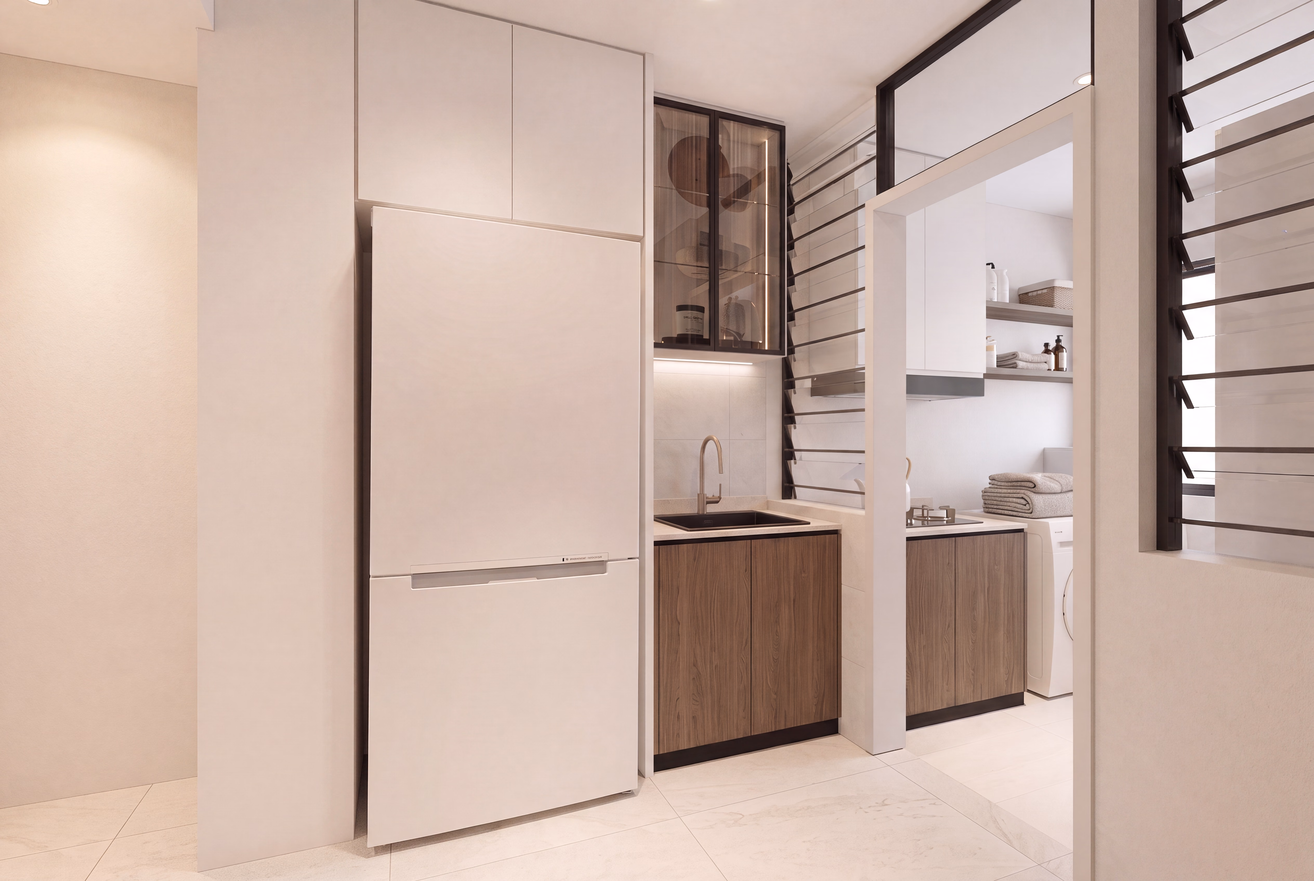Fitted kitchen with cabinetry and refrigerator in a Bodaiju Residences Medini show unit, artist's impression